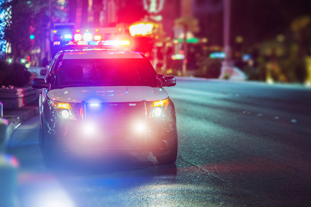 Police cruiser on street at night