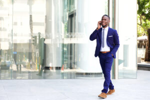 Happy man wearing a suit in the city