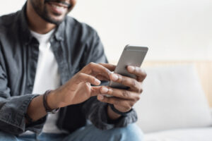 Anonymous man using a mobile phone